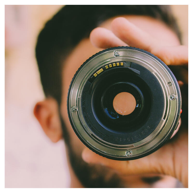 A man looking through a lense - Best Brain Supplement for Focus and Mental Clarity